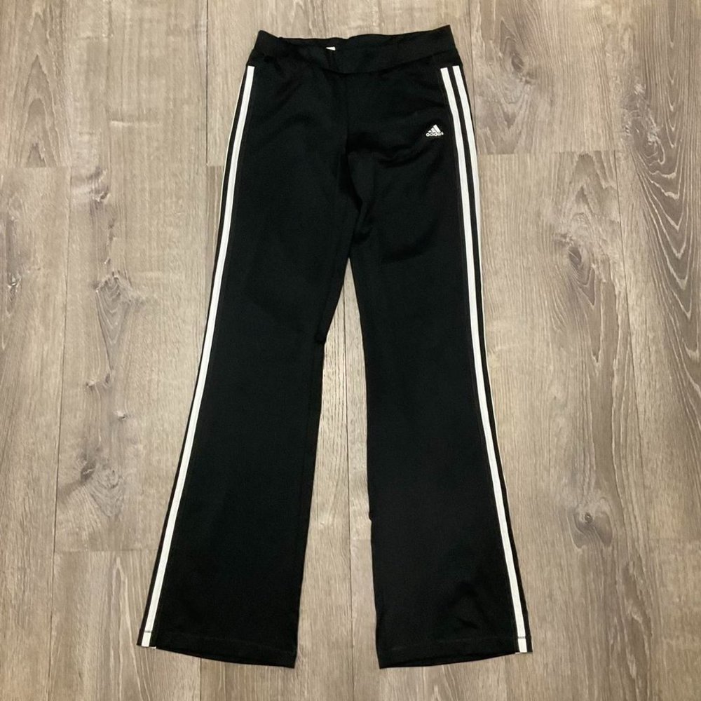 black adidas track pants with white stripes